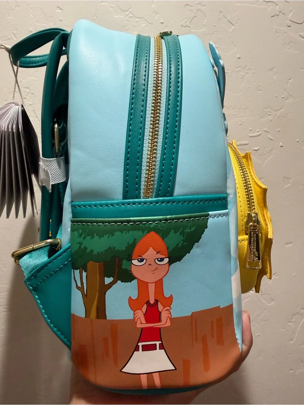 Loungefly Blue Perry the Platypus Kids Mini Backpack with Yellow Sunburst Pocket